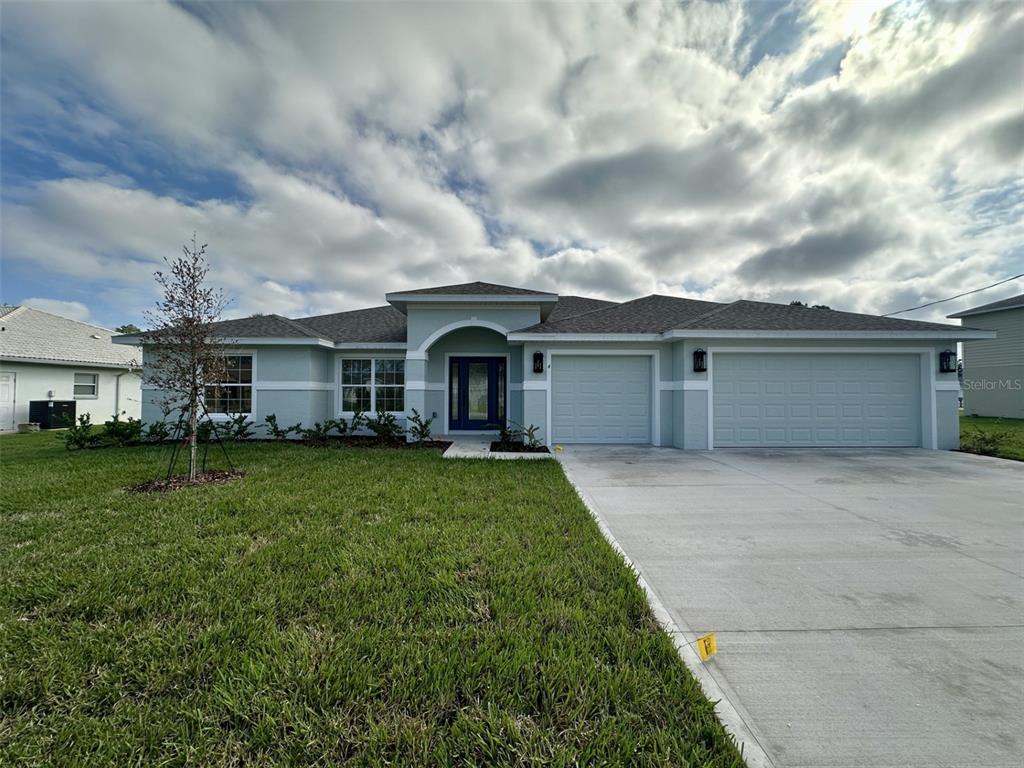 front view of a house with a garden