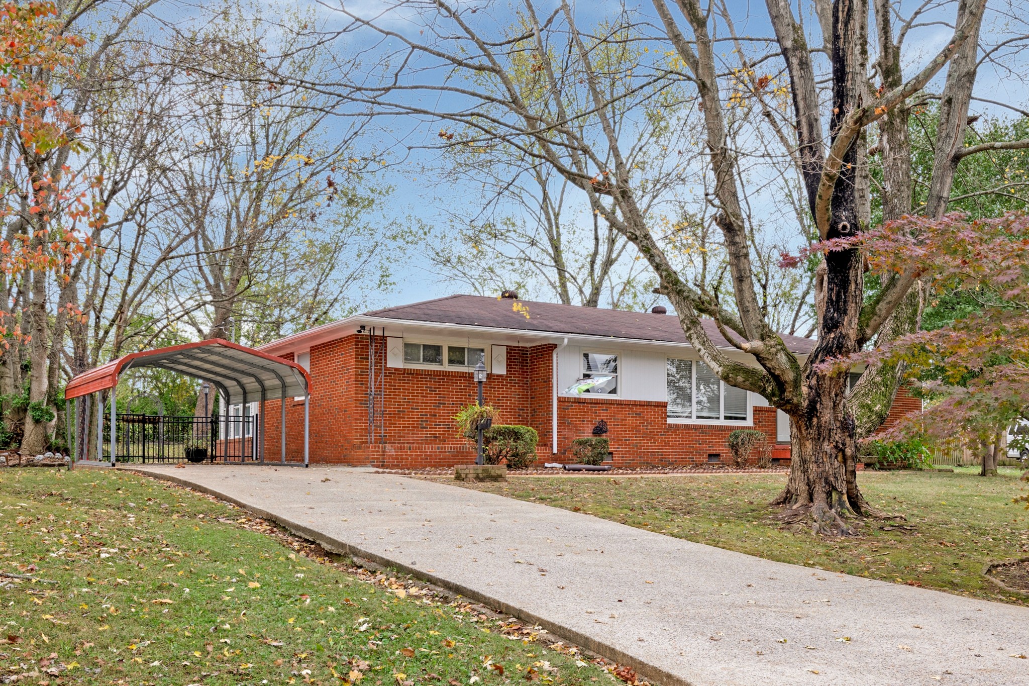 Gorgeous Mostly Brick Property Perfectly Nestled on a Wooded almost Half Acre Lot!