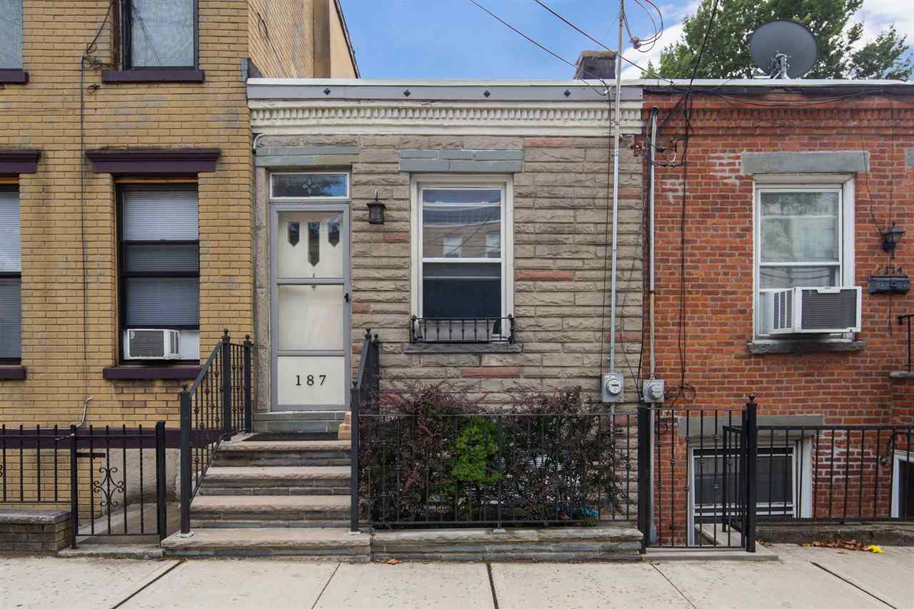 a front view of a house with stairs