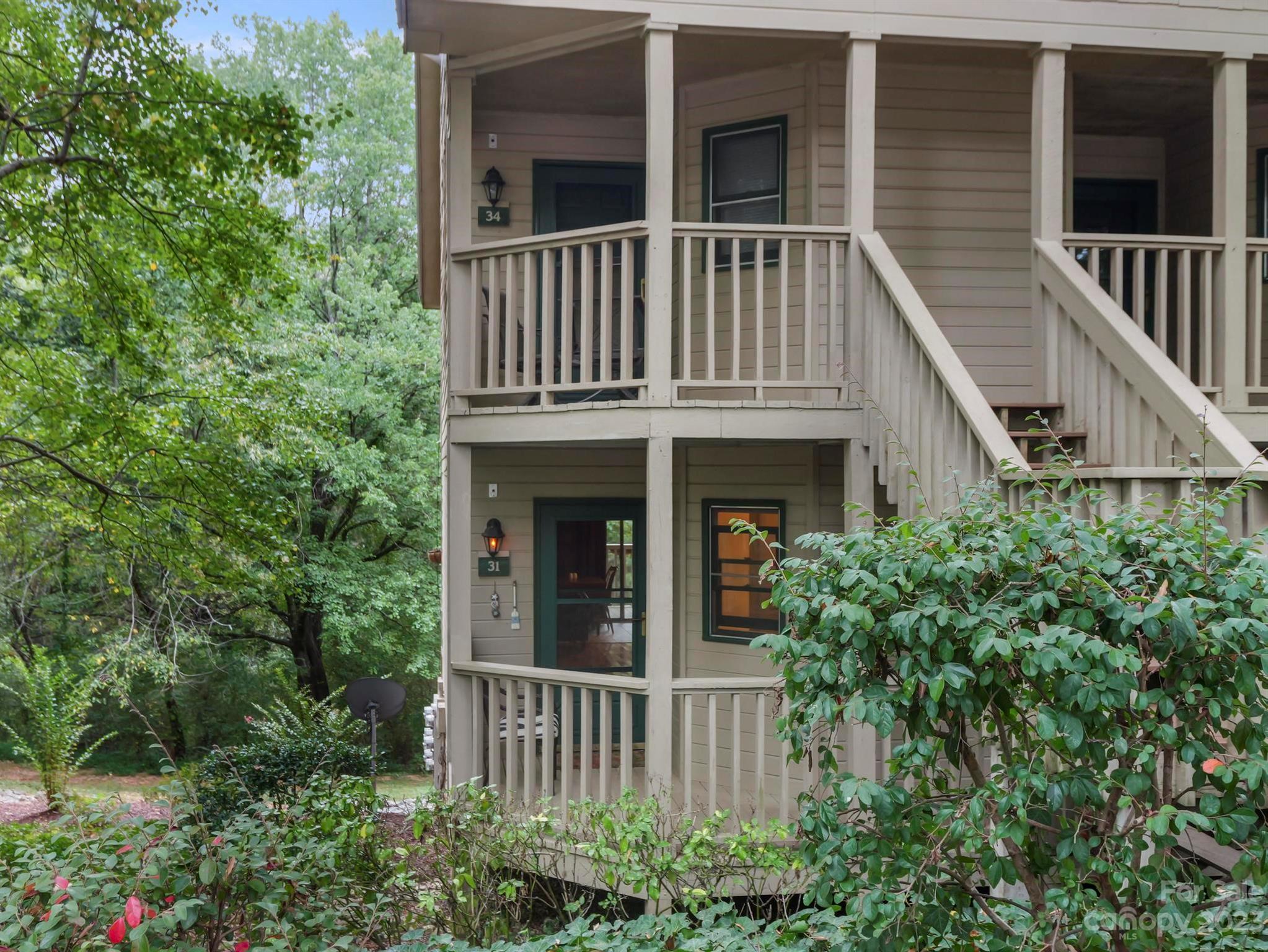 a view of house with window and deck