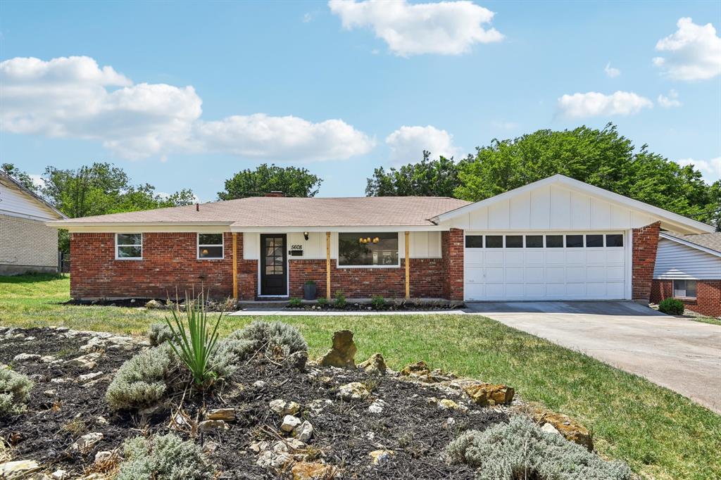 front view of a house with yard