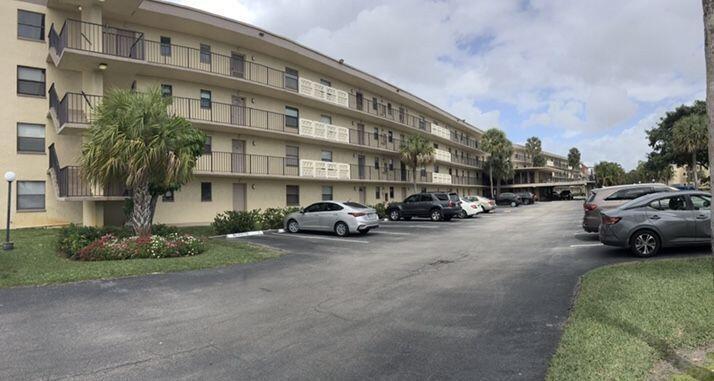 a view of a cars parked in front of a building