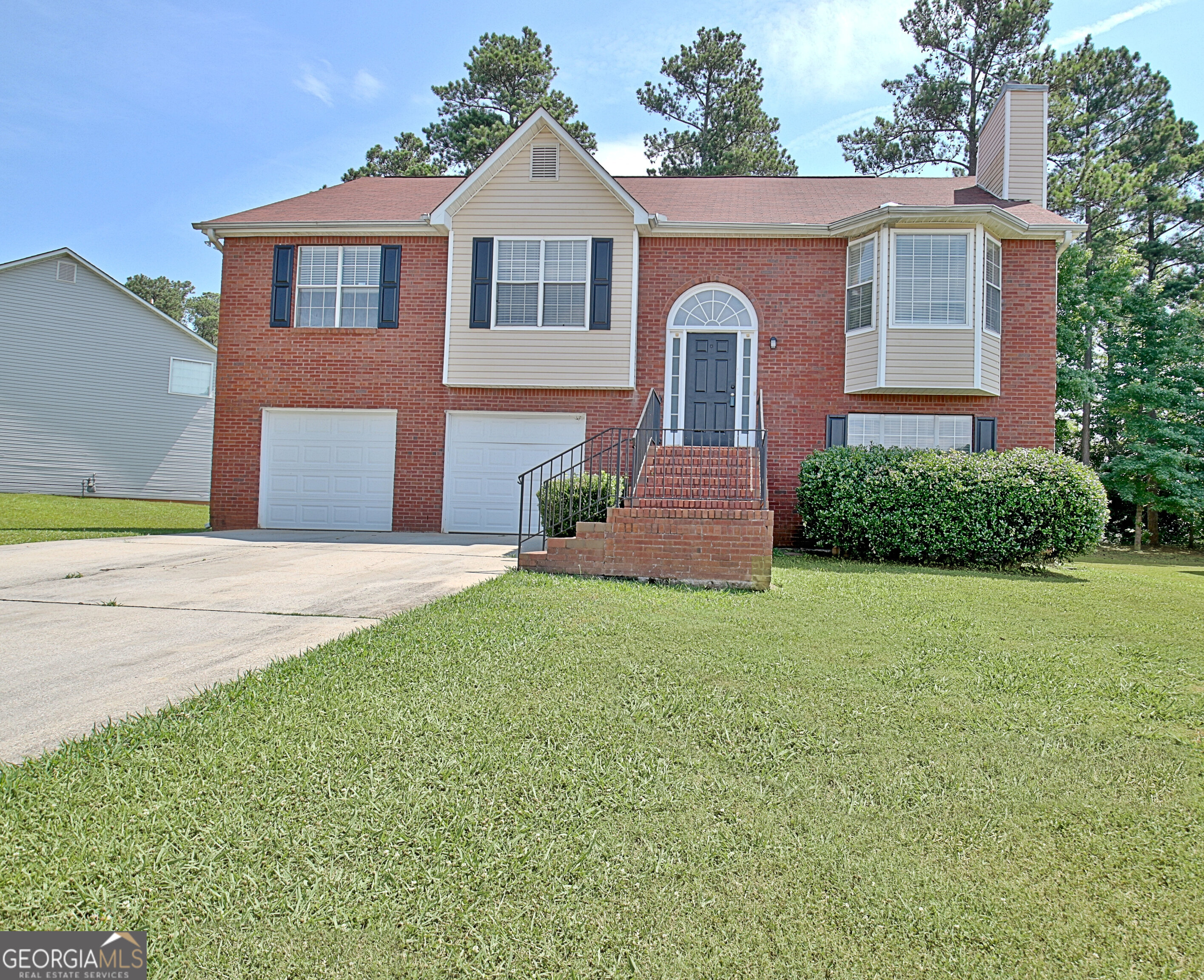 a front view of a house with a yard