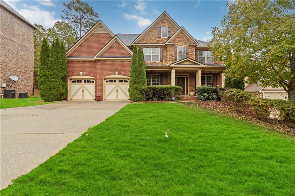 a front view of a house with a yard