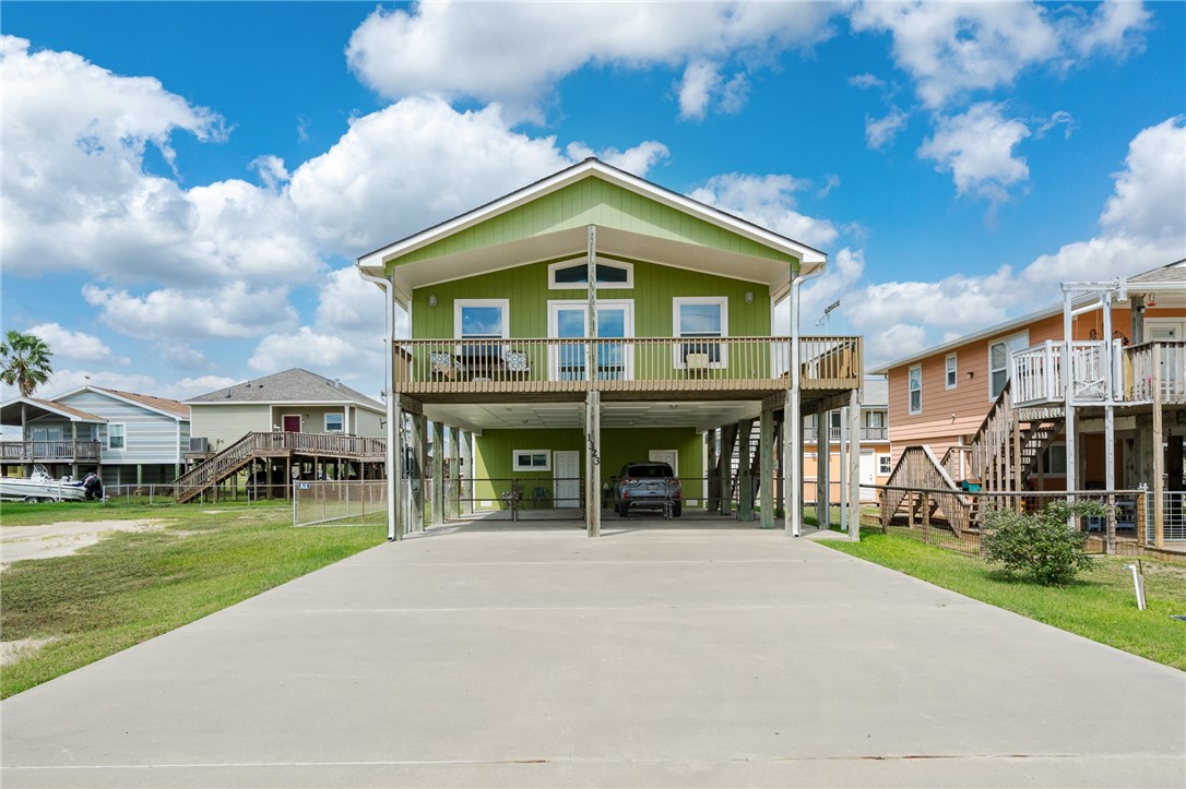 a view of house with yard and green space