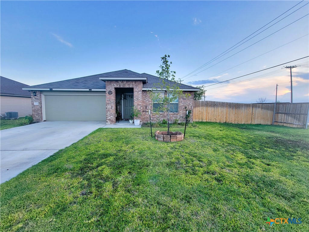 a house view with a sitting space and garden