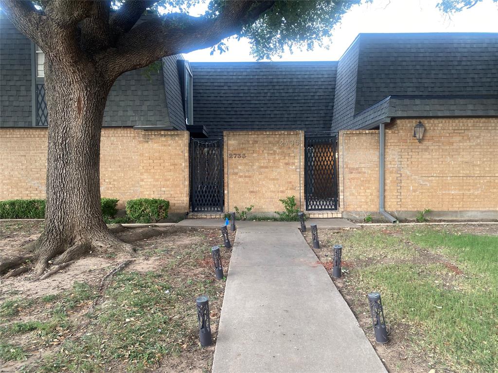 a house view with a backyard space