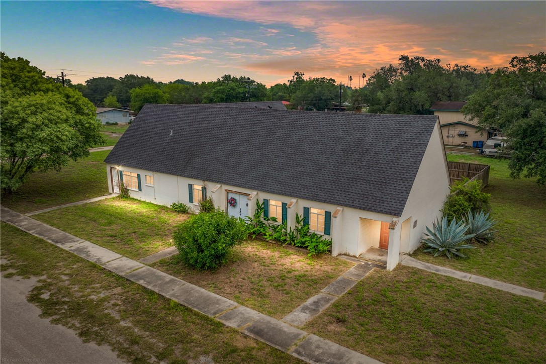 a aerial view of a house with a yard