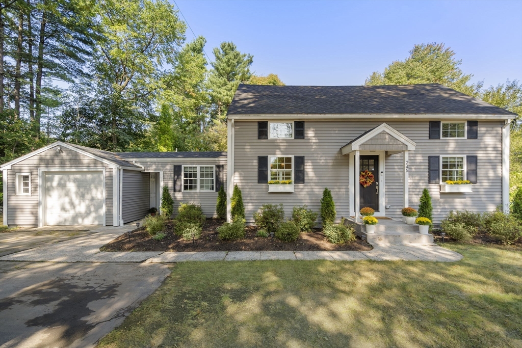 a front view of a house with garden