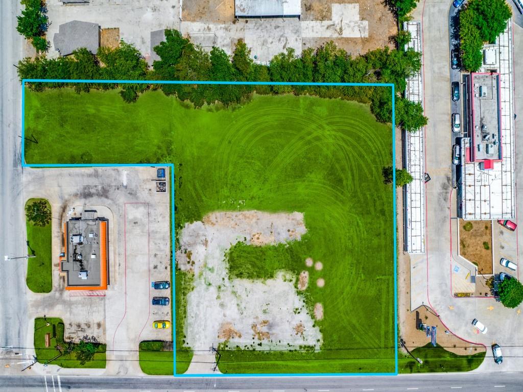 an aerial view of a house with a pool yard and outdoor seating