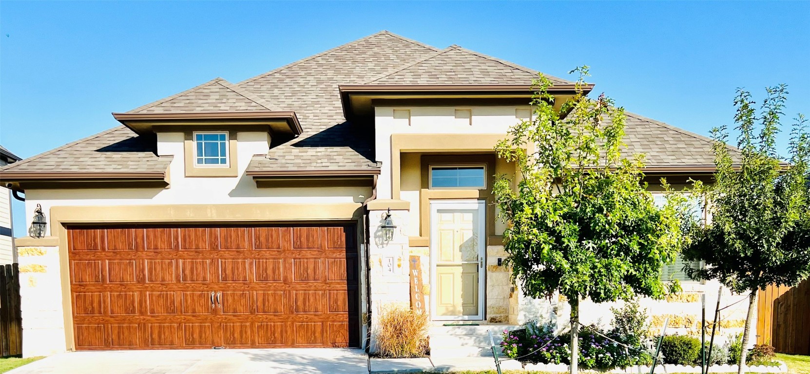 a front view of a house with a yard