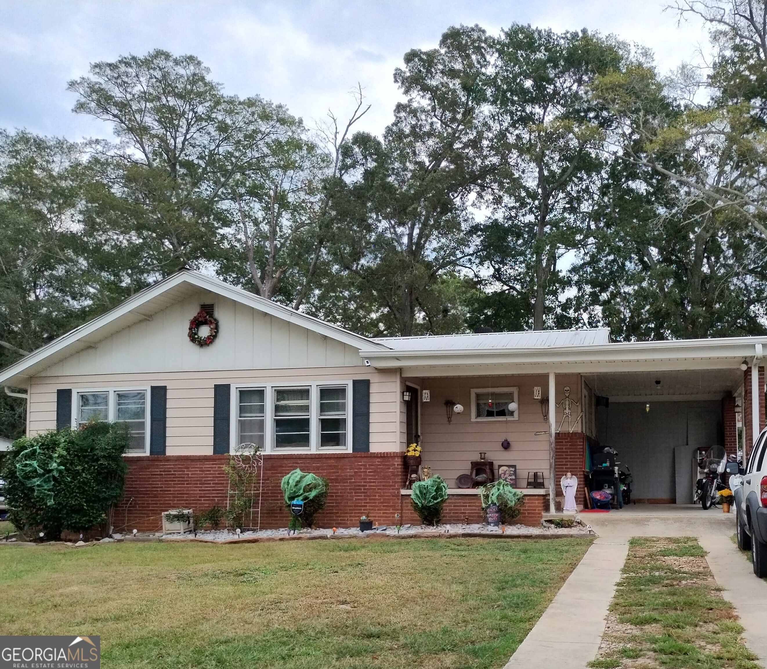 a front view of a house with a yard and porch