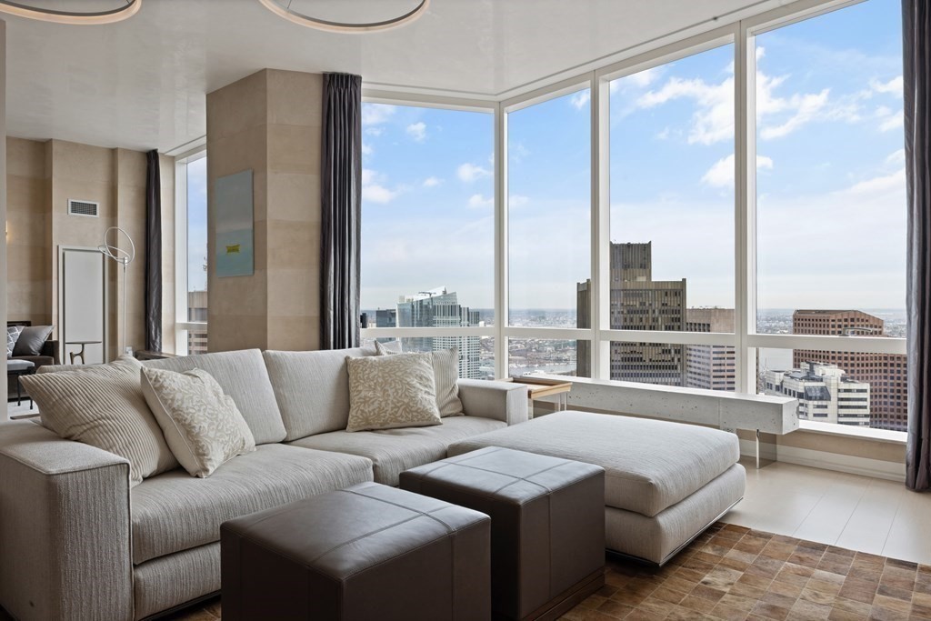 a large bedroom with a large window and a balcony