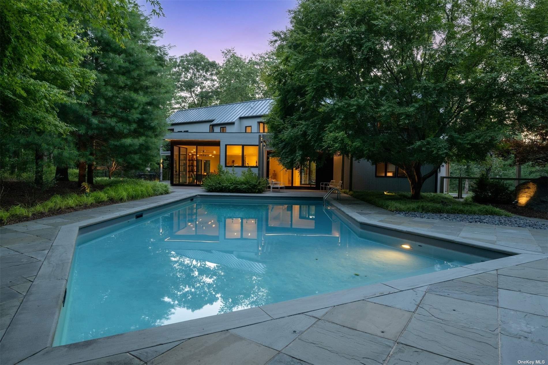 a view of a swimming pool with a yard