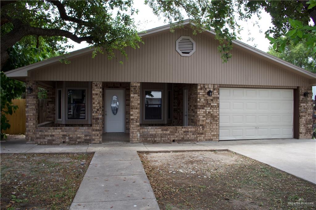 a front view of a house with yard