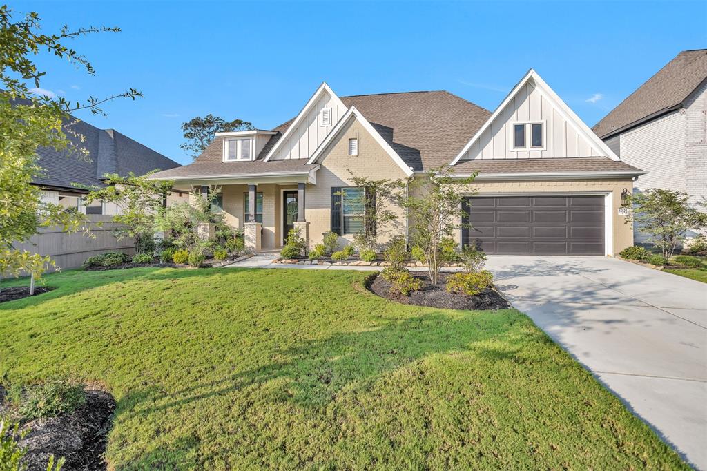 a front view of house with yard and green space