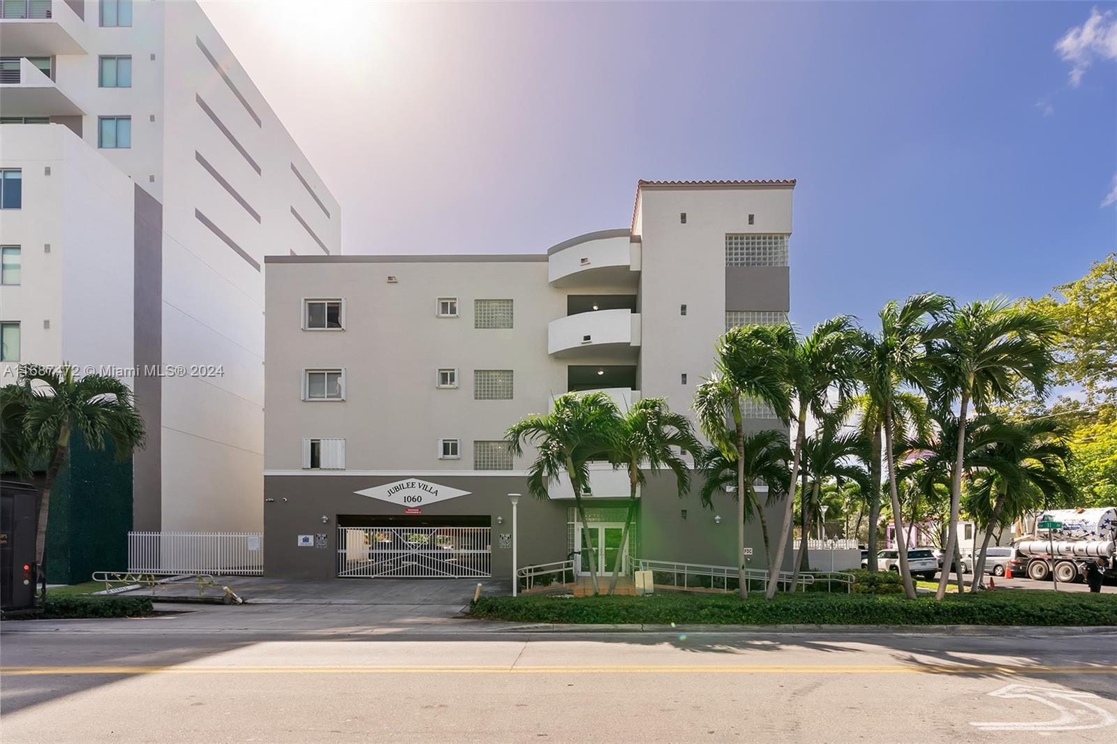 front view of a building with a garden