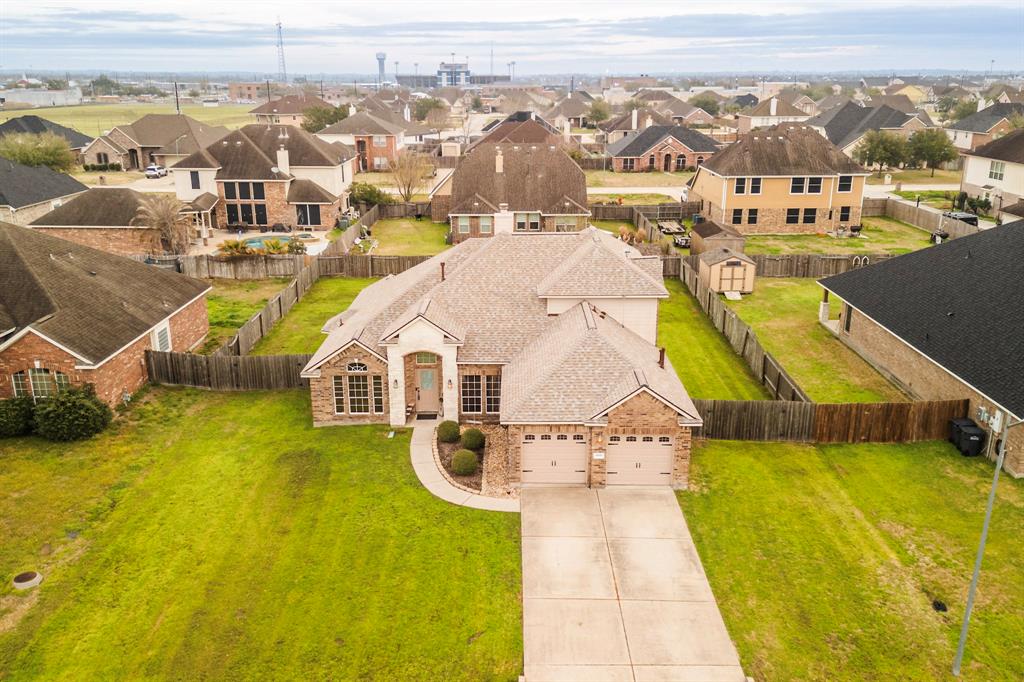 an aerial view of residential houses with swimming pool