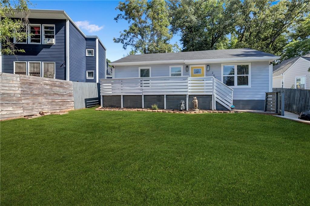 a view of house with a yard