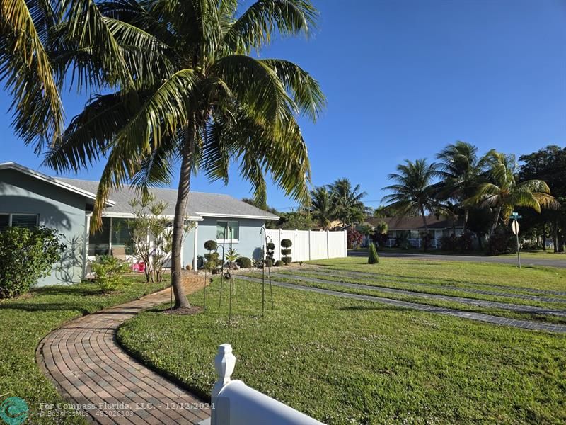 a view of a house and a yard