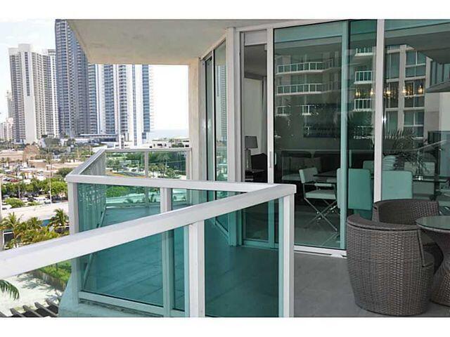 a view of swimming pool from a balcony