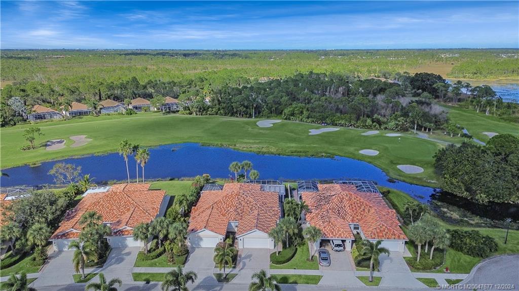 an aerial view of a house with a yard swimming pool outdoor seating and yard