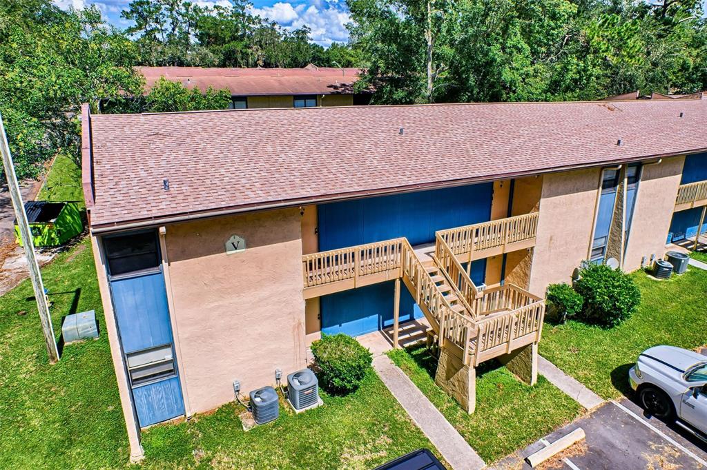 a aerial view of a house with a yard