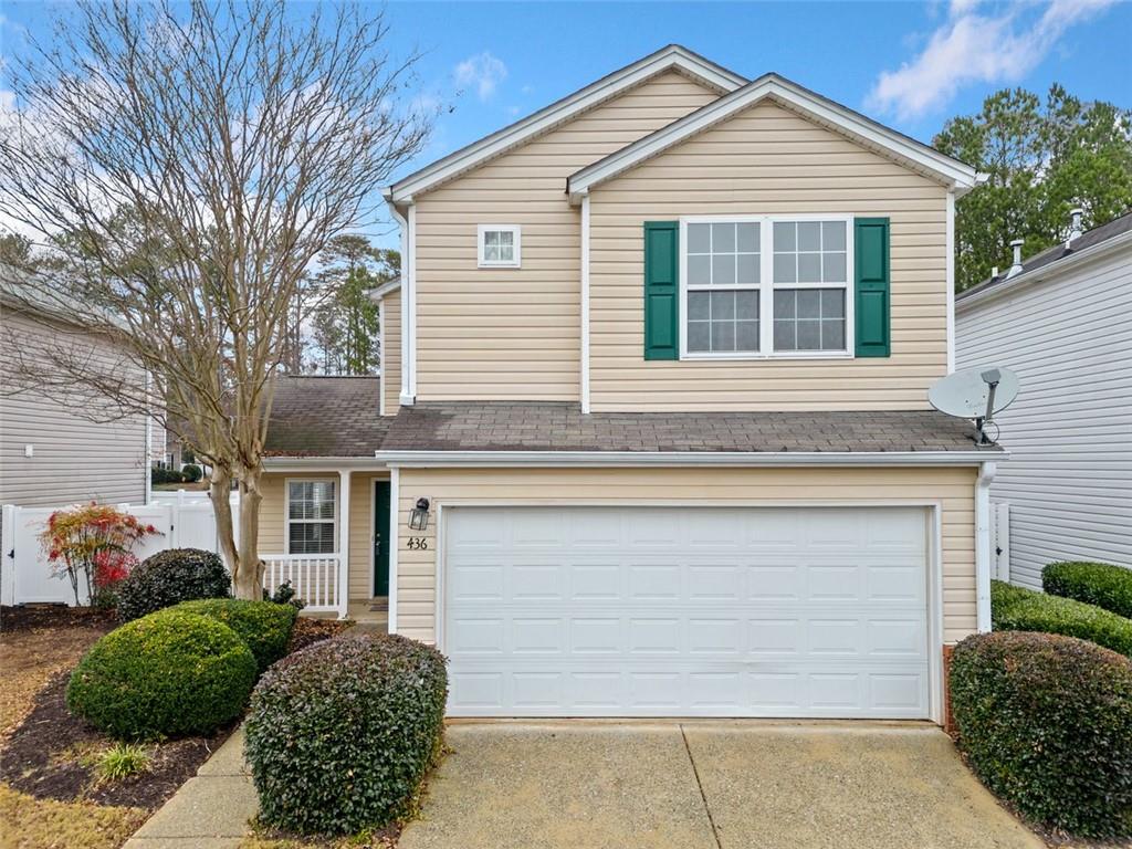 a front view of a house with a garage