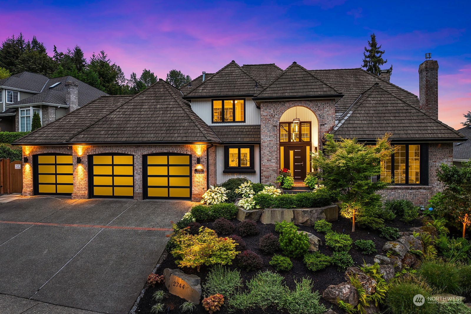 a front view of a house with a yard