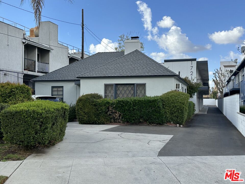 a house view with a garden space