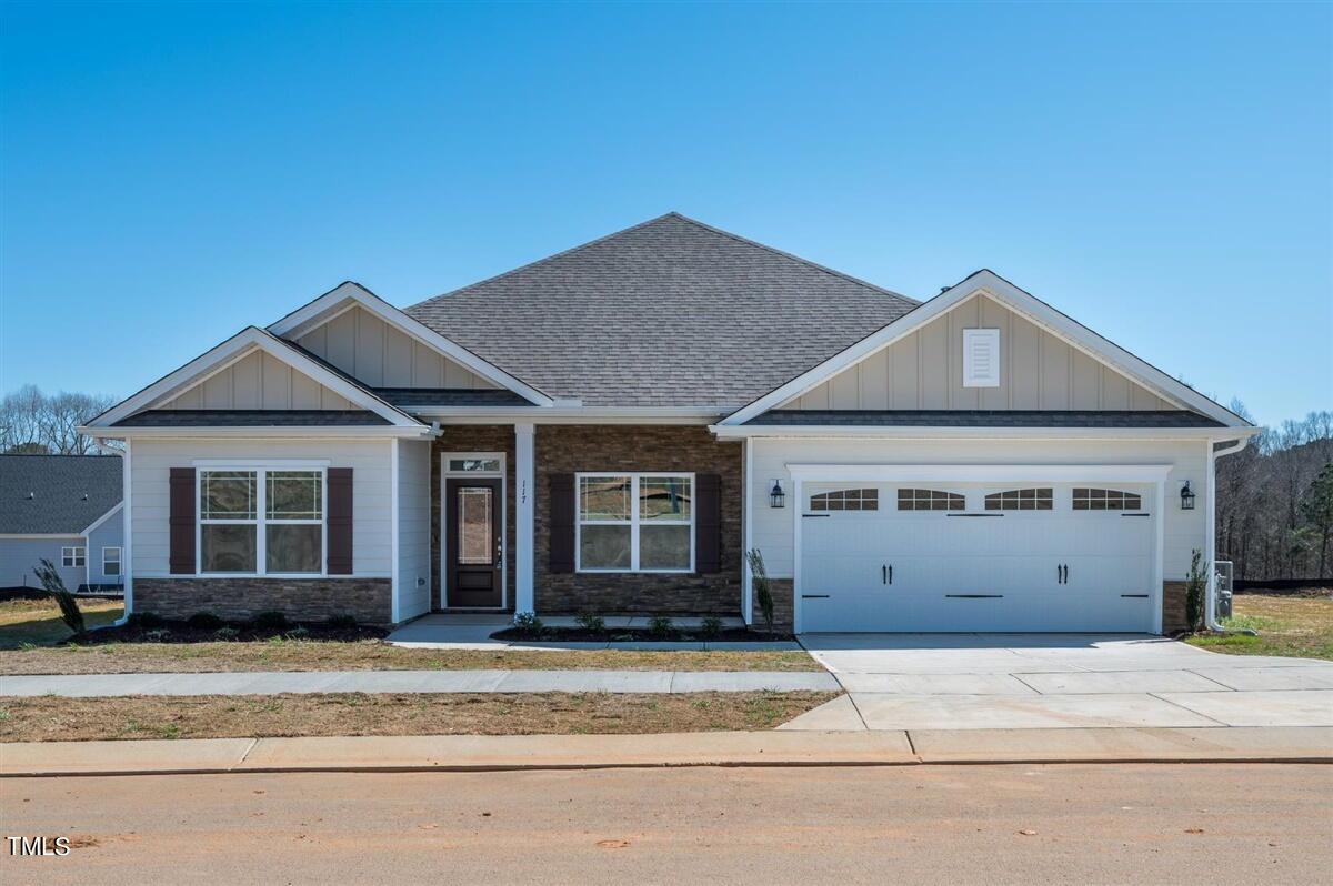 a front view of a house with a garage