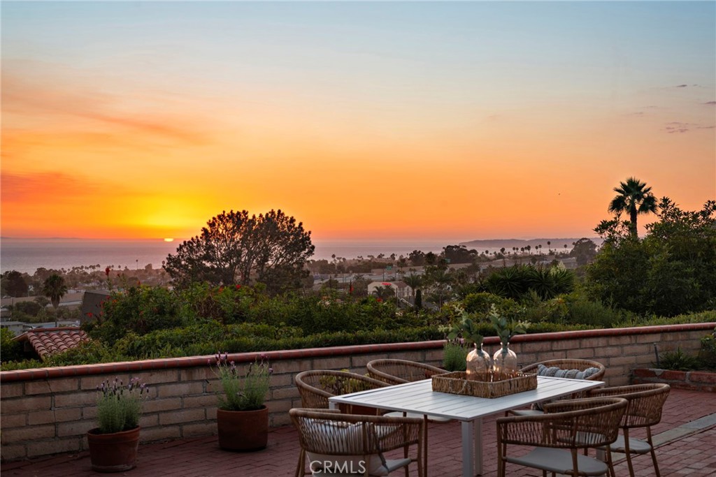 a view of a chairs and table in patio