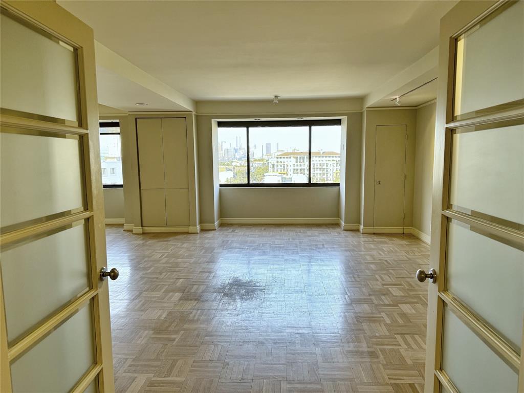 a view of room with window and hardwood floor