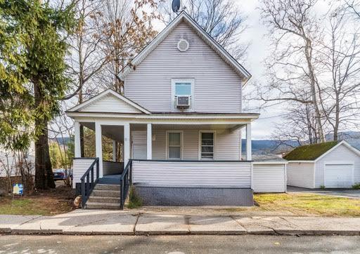 View of front of property with a covered porch.