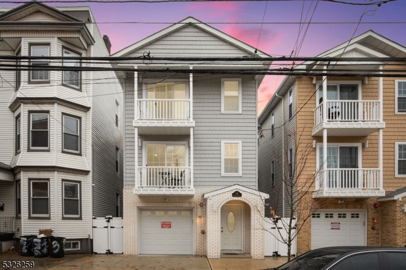 a front view of a house with a lot of windows