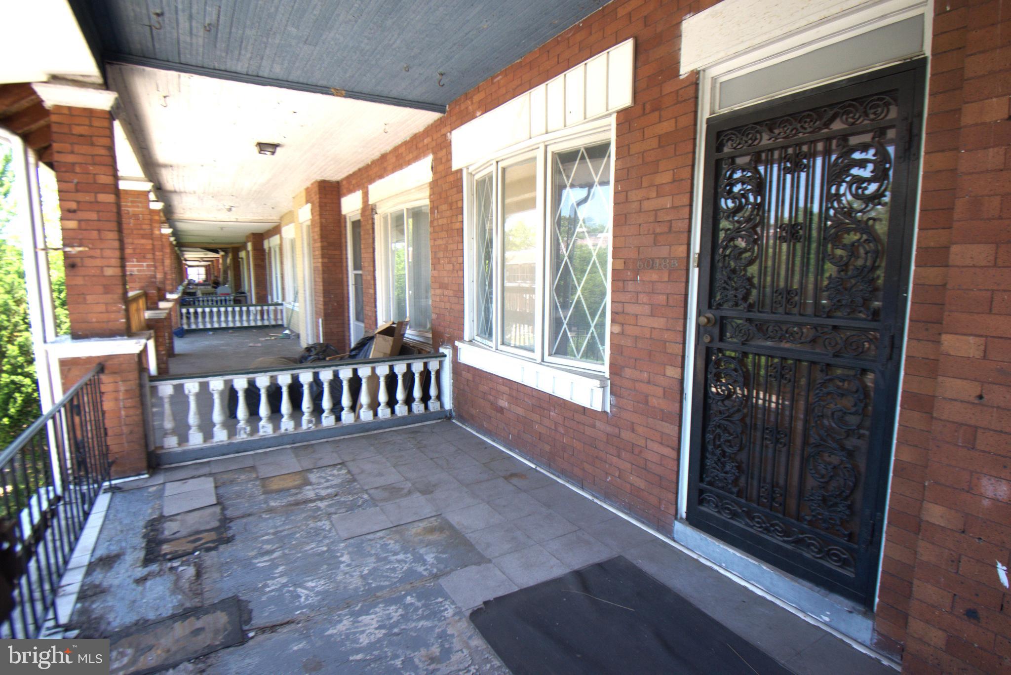 a view of porch with a bench