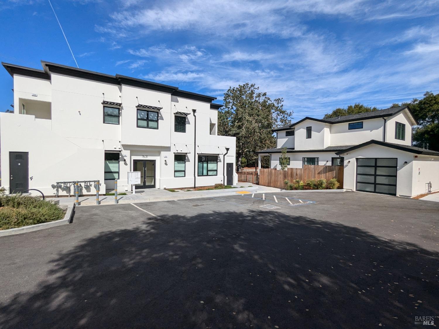 a front view of a building with a road