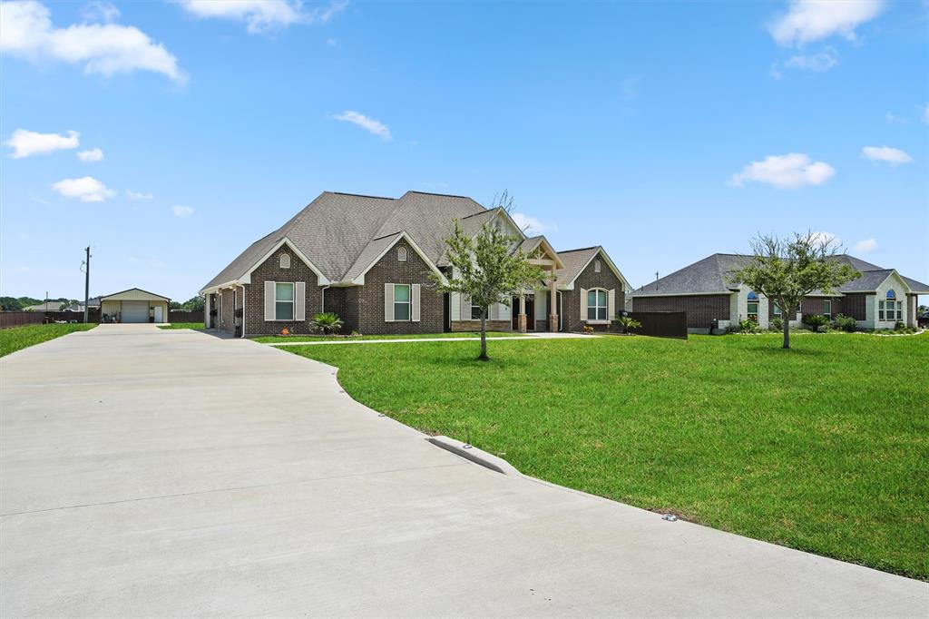 a view of an house with backyard space and garden