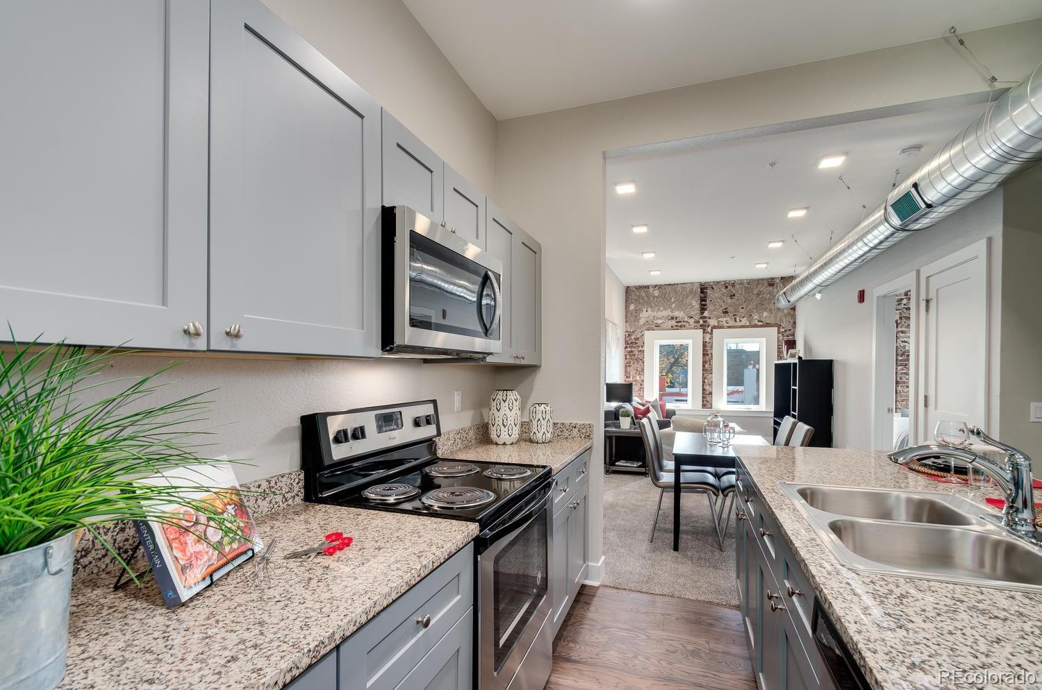 a kitchen with granite countertop lots of counter top space