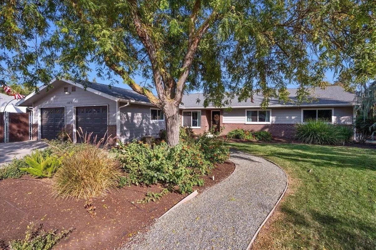 front view of a house with a yard