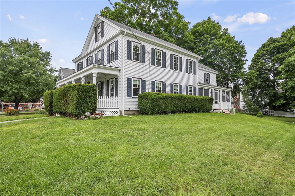 a front view of a house with a yard