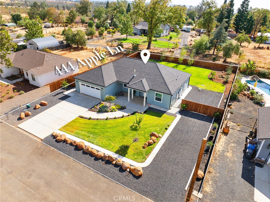 an aerial view of a house with a swimming pool