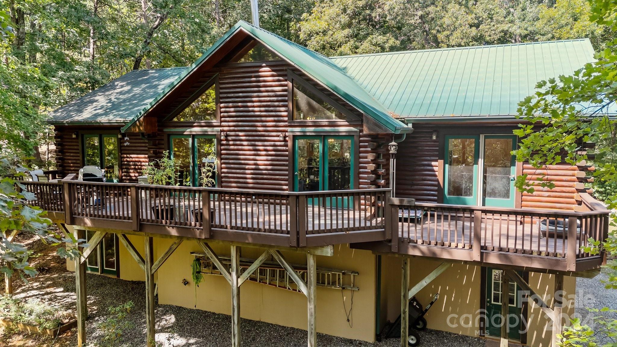 a view of a house with wooden deck