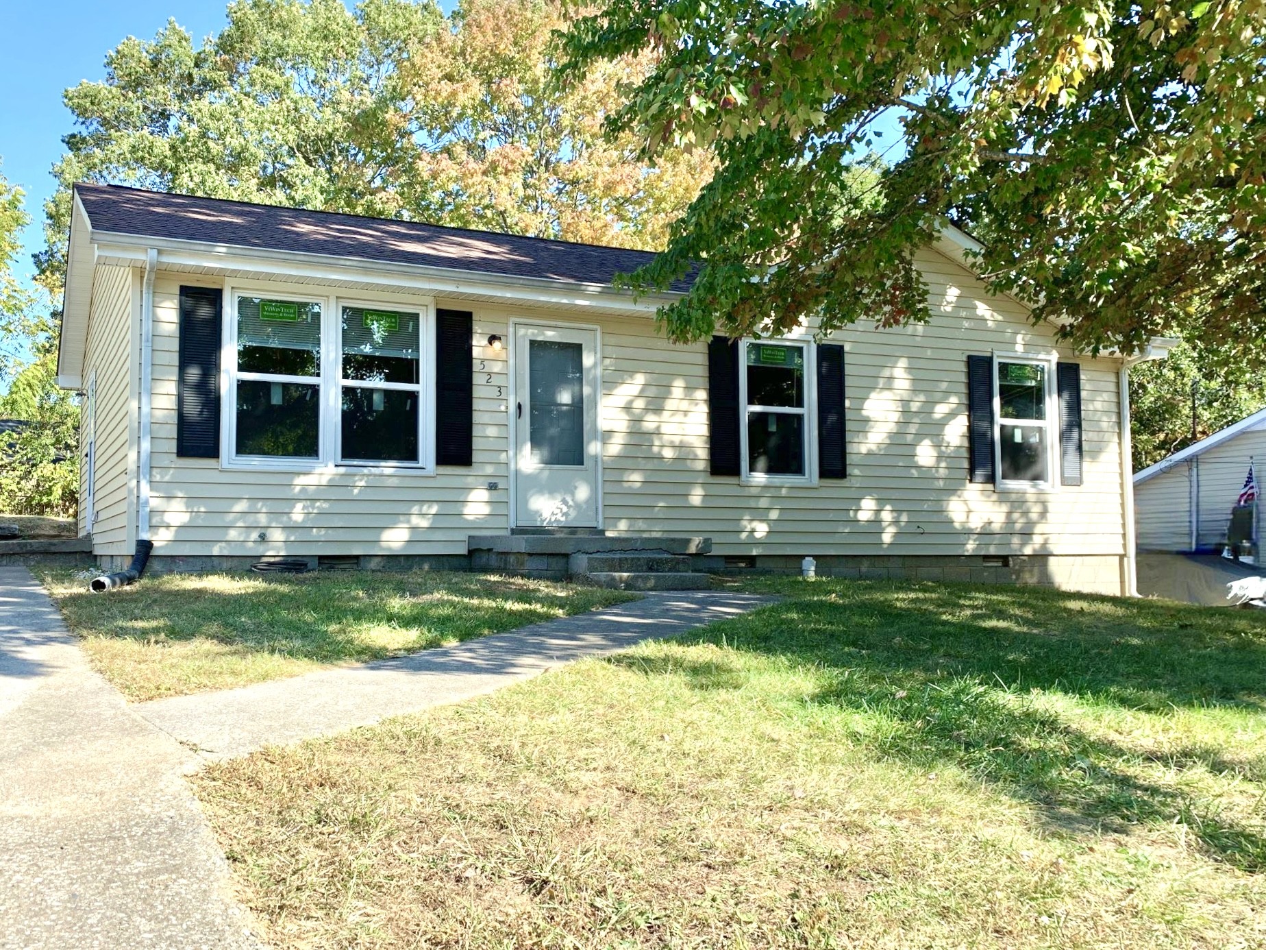 a view of house with a yard