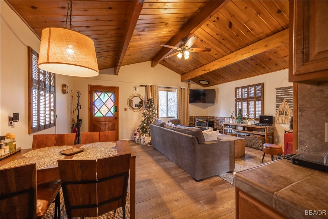 a living room with lots of furniture and a chandelier