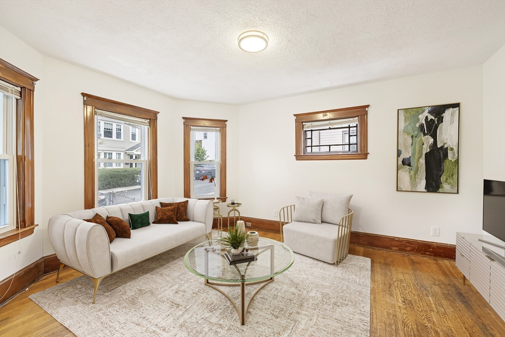 a living room with furniture and a rug