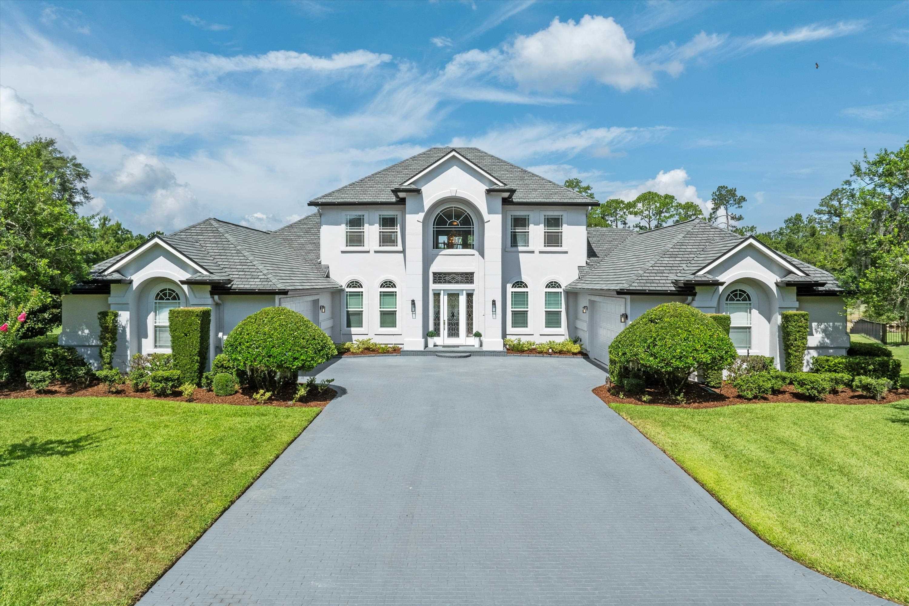 a front view of a house with a yard