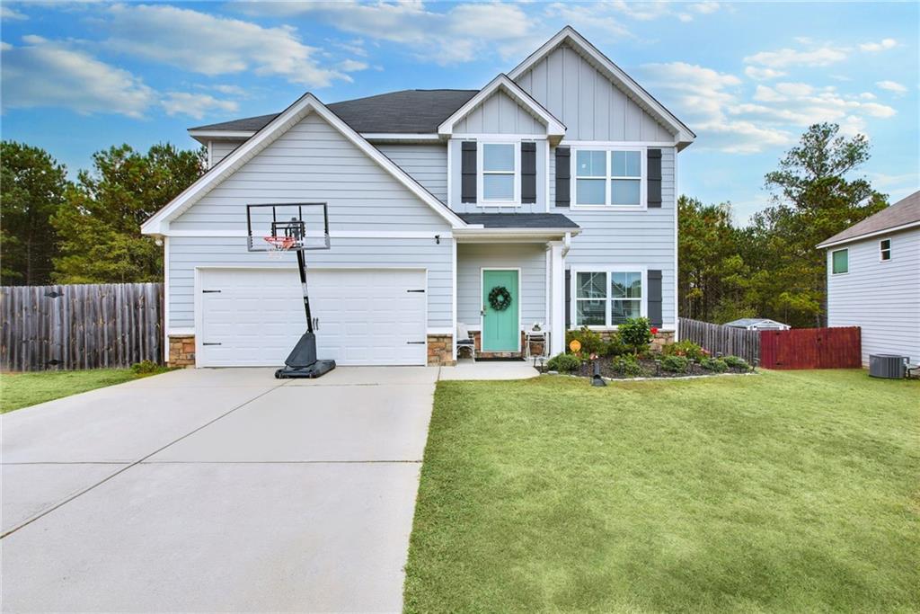 a view of a yard in front view of a house