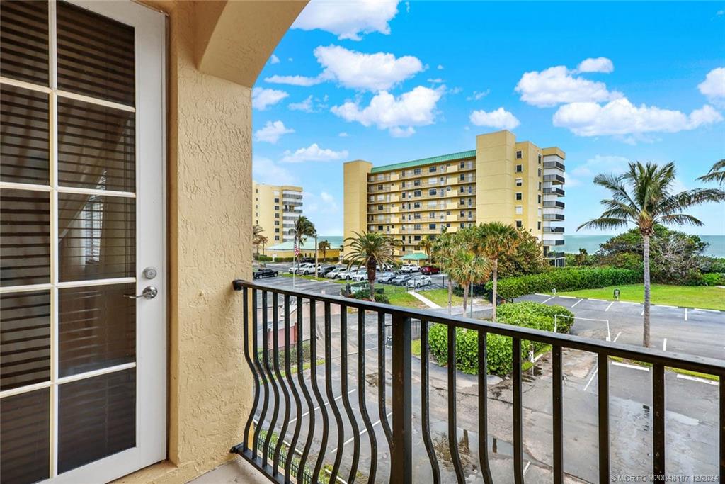 a view of a balcony with city view