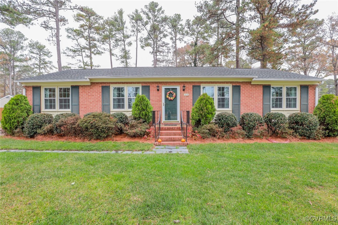 front view of a house with a garden